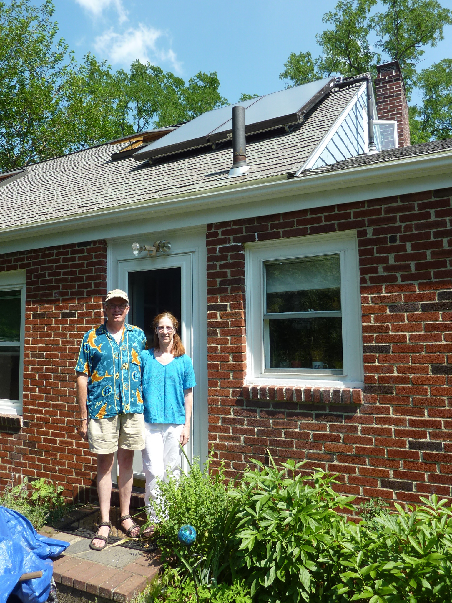 Bill and Patti say the solar hot water system in their Arlington home has cut their electric bills in half.