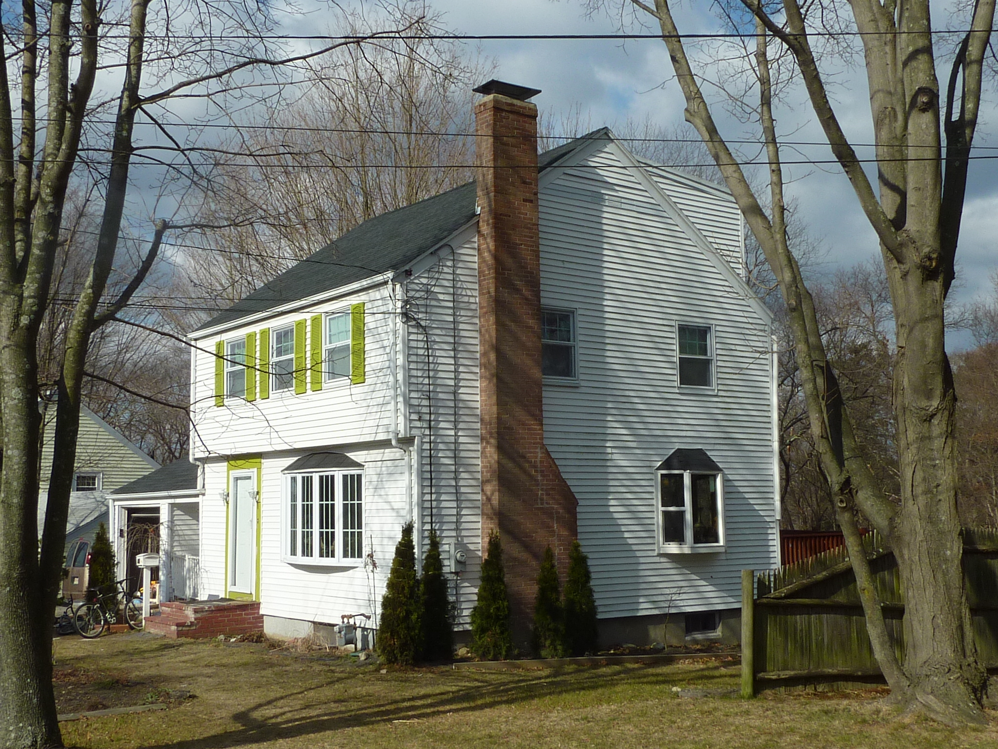 The bay window from the Reuse Center can be seen on the first floor to the left of the chimney.