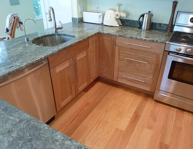 Countertops are granite of an unusual green shade.