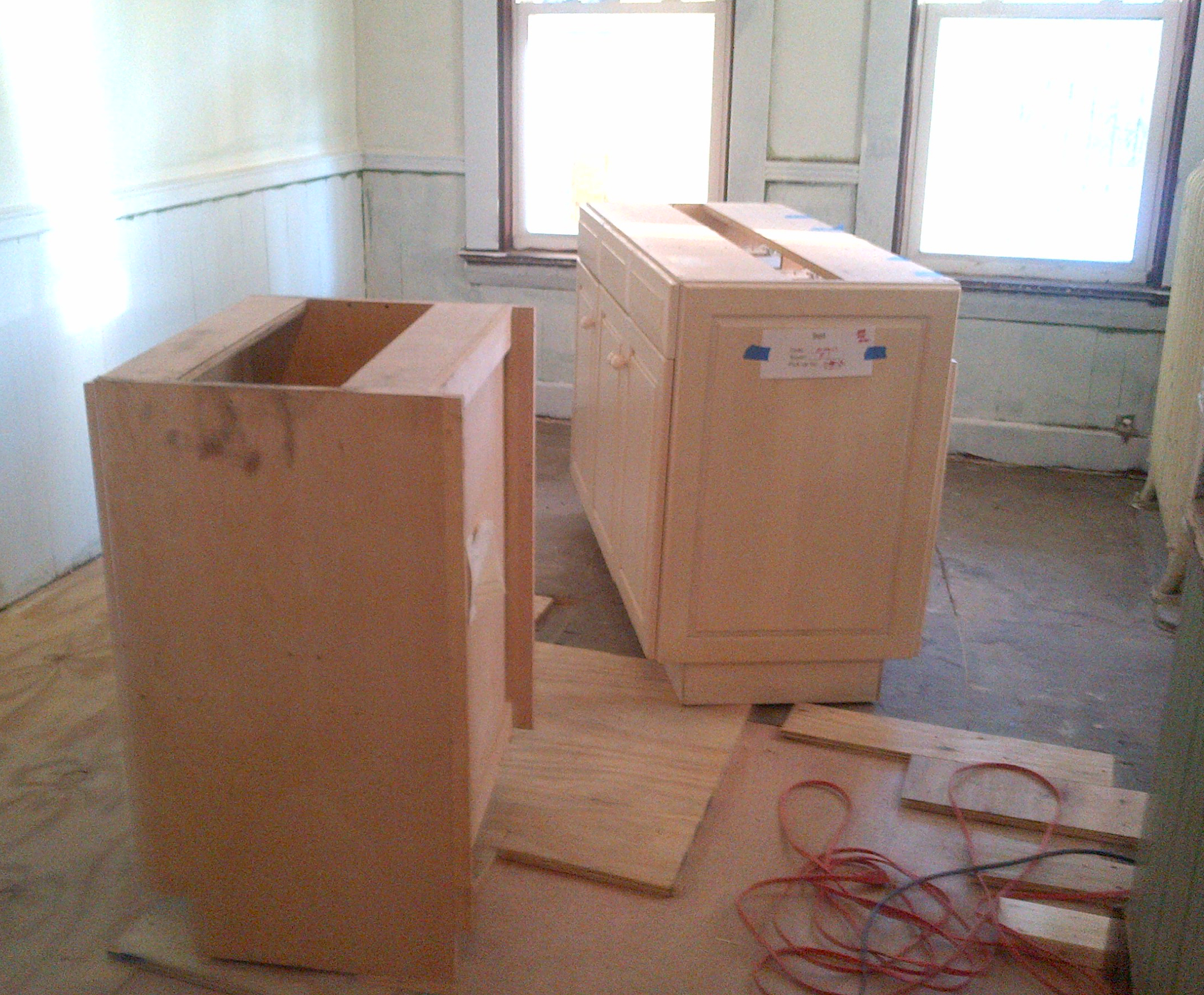 The large cabinet set she bought was enough for both kitchens.