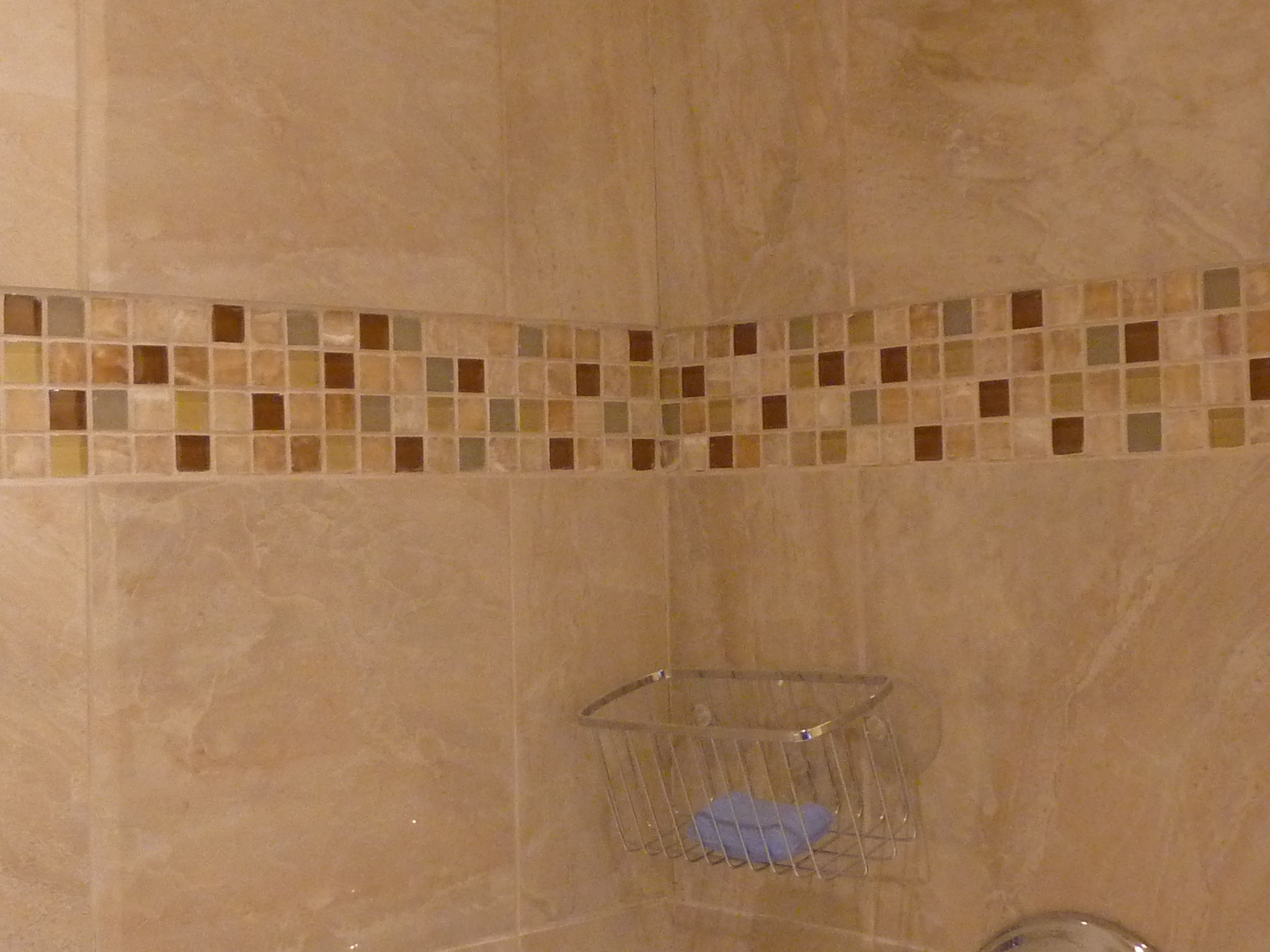 With Reuse Center tile, she created a pattern on the shower wall.
