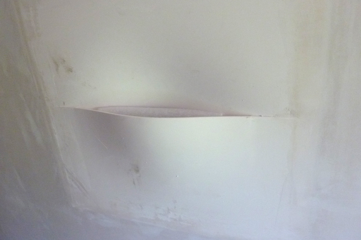 LED fixtures blend into the plaster walls