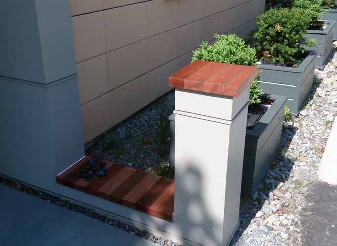 This mahogany used on this post and garden wall give the space an elegant look.