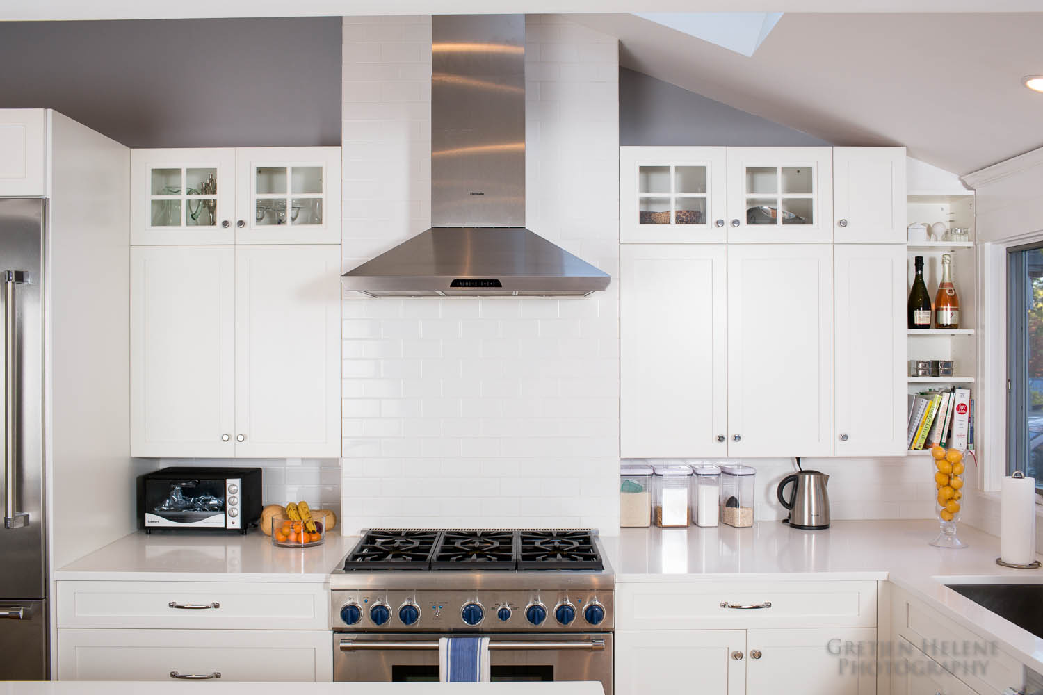 White subway tile is used for the backsplash.