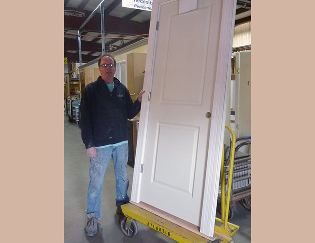 John Hamilton picked up a two-panel pre-hung door. “It would probably run $175 new.” John’s cost: $50.