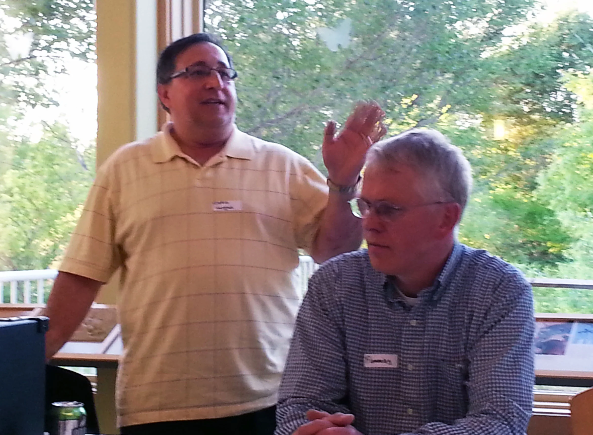 Mario Vargas (left) spoke about post-ice-dam insurance claims at BBR's annual meeting, where he was joined by panelist Flemming Lund (right).