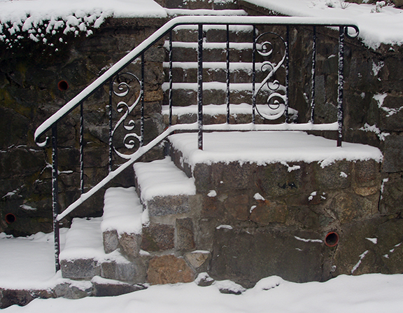Salt melts ice effectively, but can corrode iron railings.