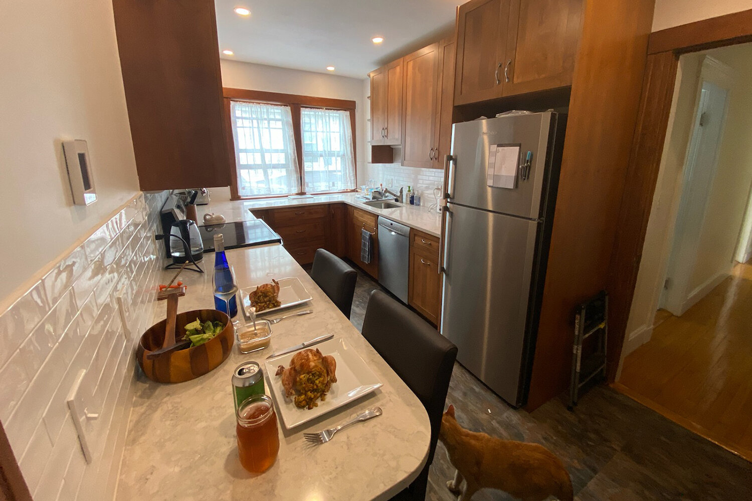 Resilient quartz countertops and recycled-content flooring are low maintenance choices for this young family (and their pets).