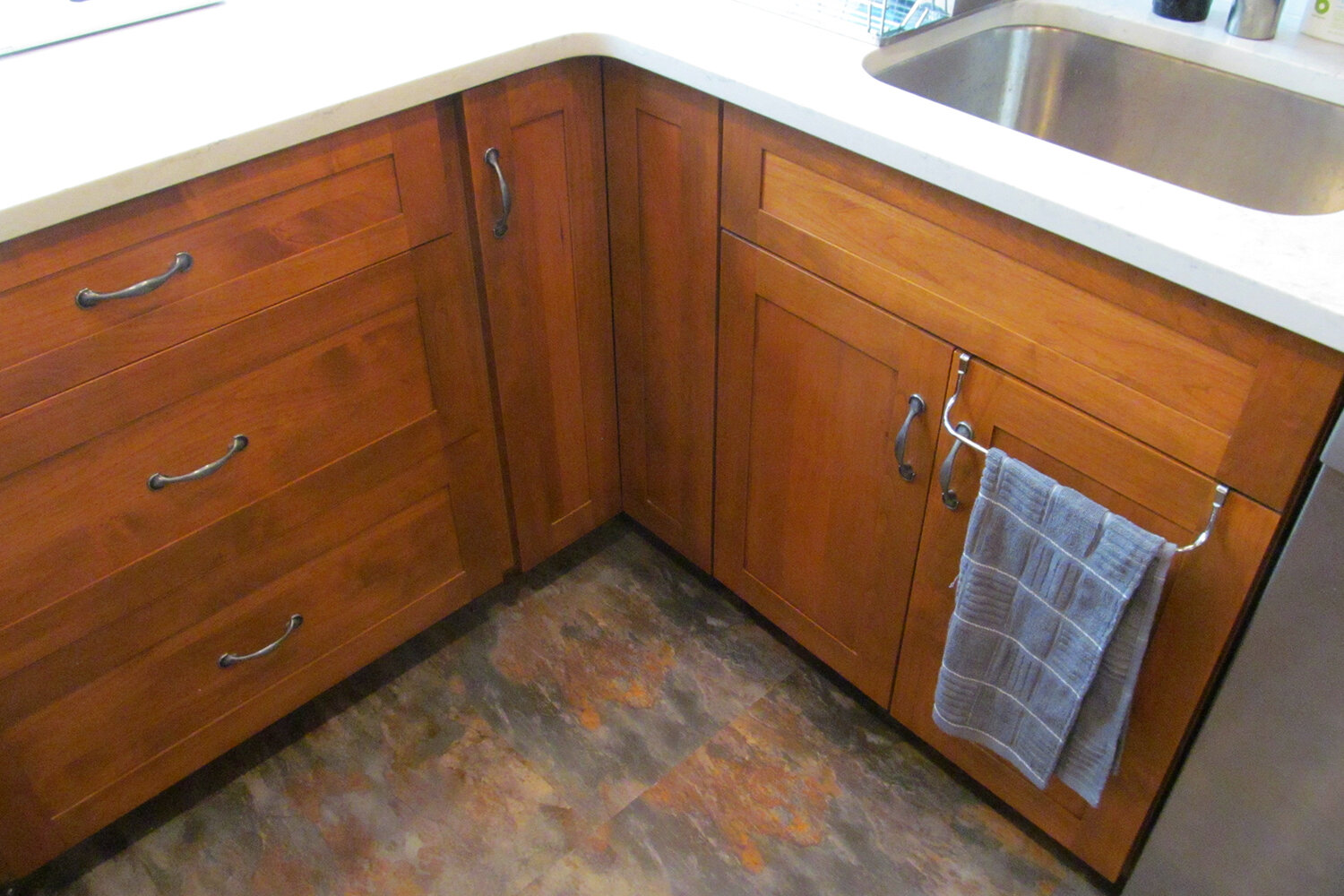 Frameless cabinets in alder are from Artizen. Lazy susan corner cabinets maximize storage space.