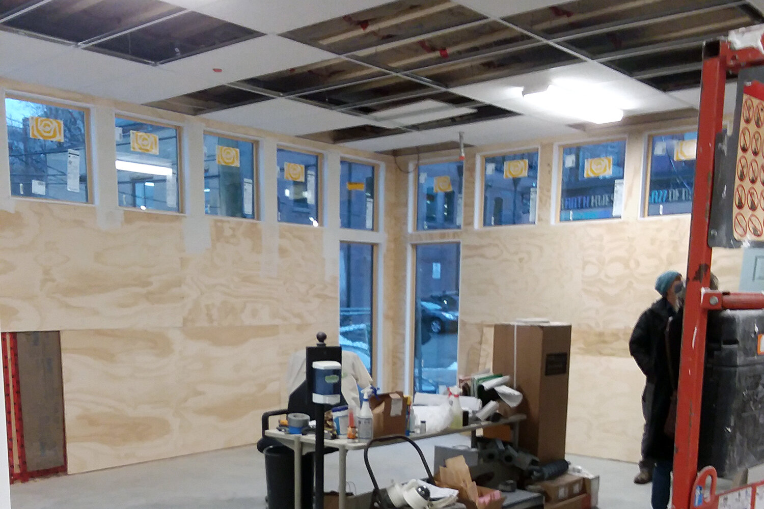 Inside the addition, plywood is up on the walls