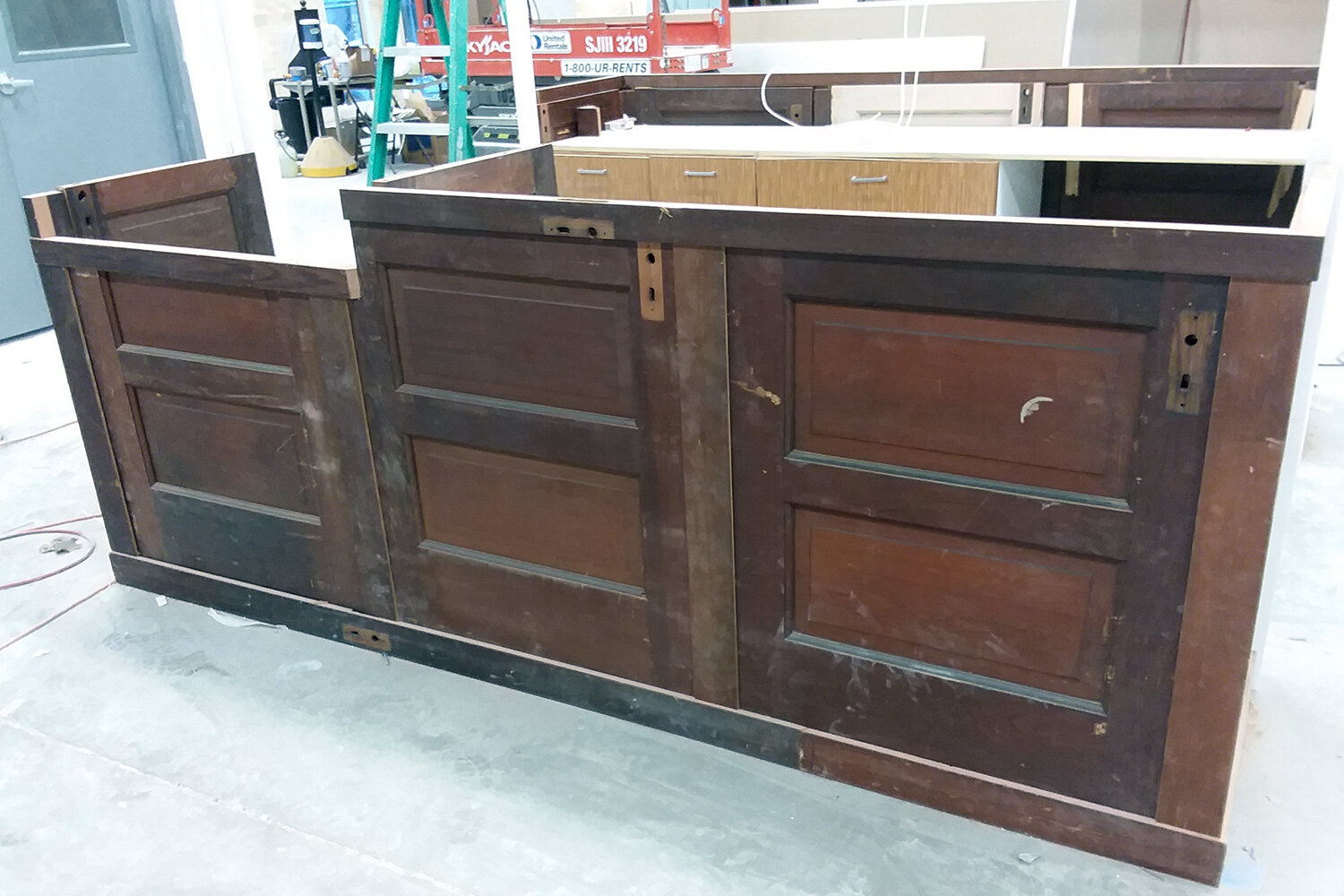 The new checkout station features vintage doors and donated cabinets