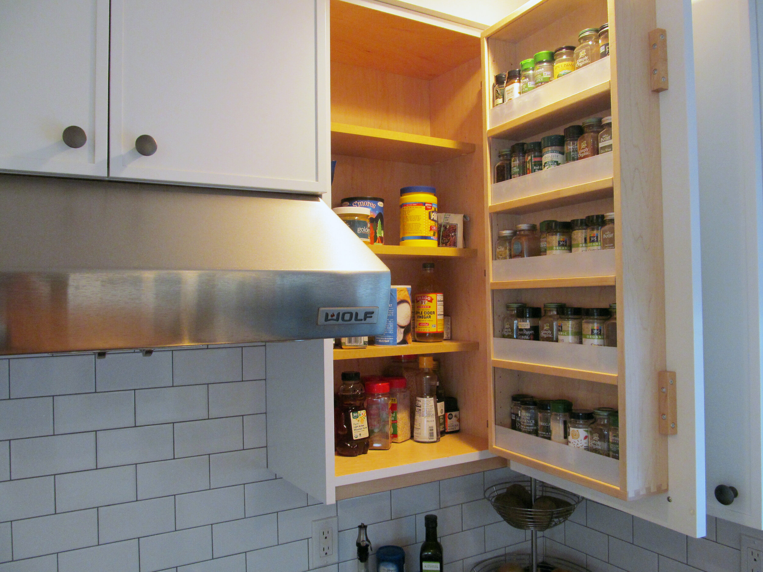 A built-in spice rack keeps seasonings organized and handy.