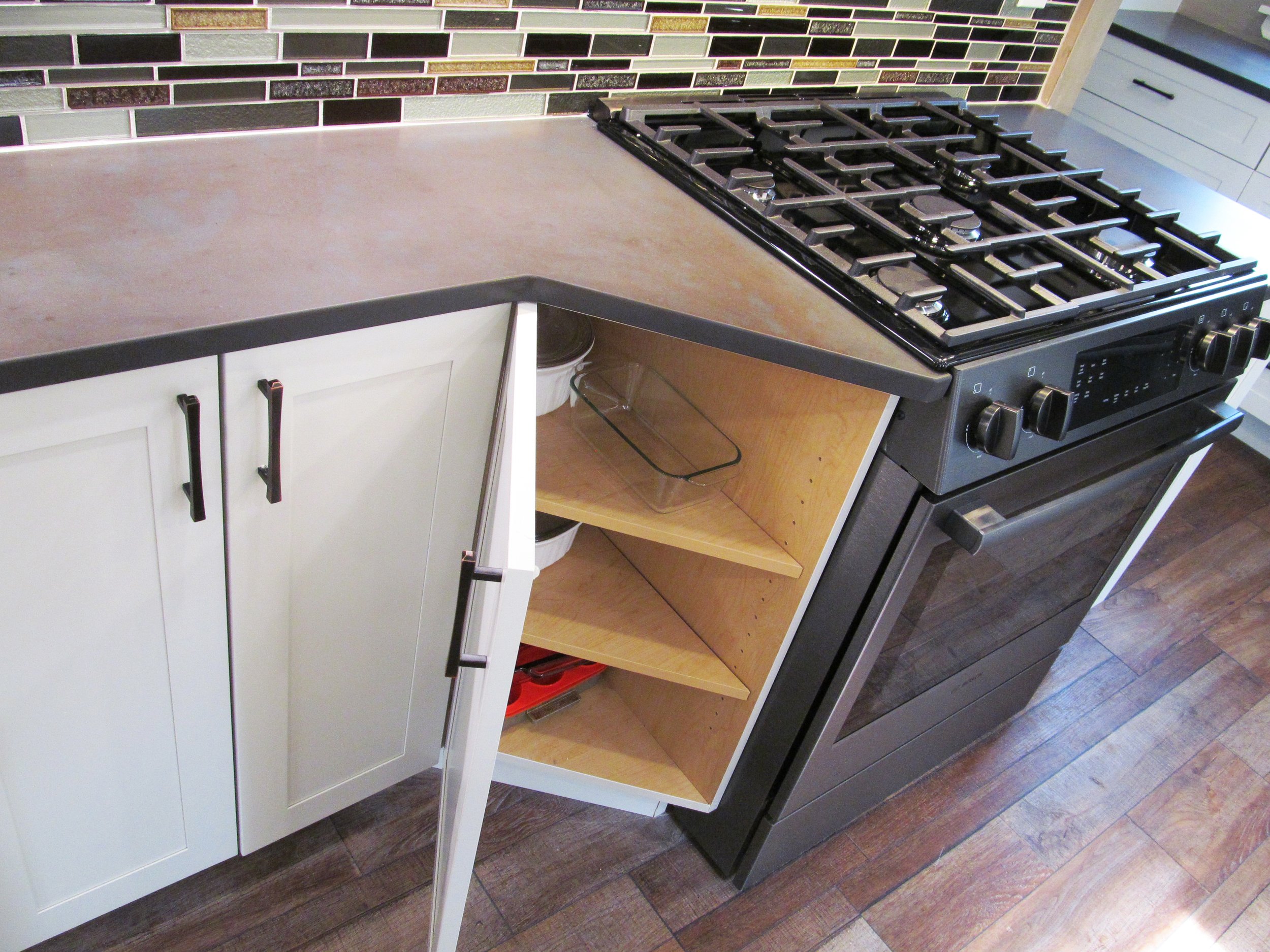 Angled cabinet makes the transition from shallow to range depth