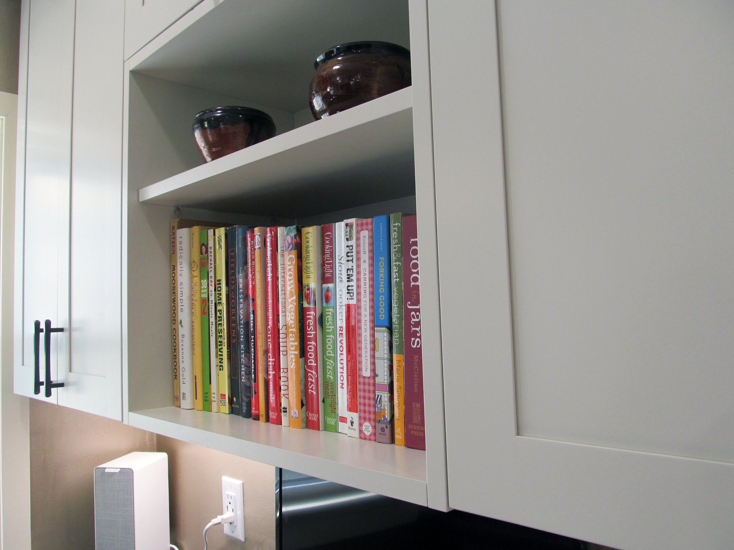 The depth of this open cabinet was increased to align with the doors of adjacent cabinets