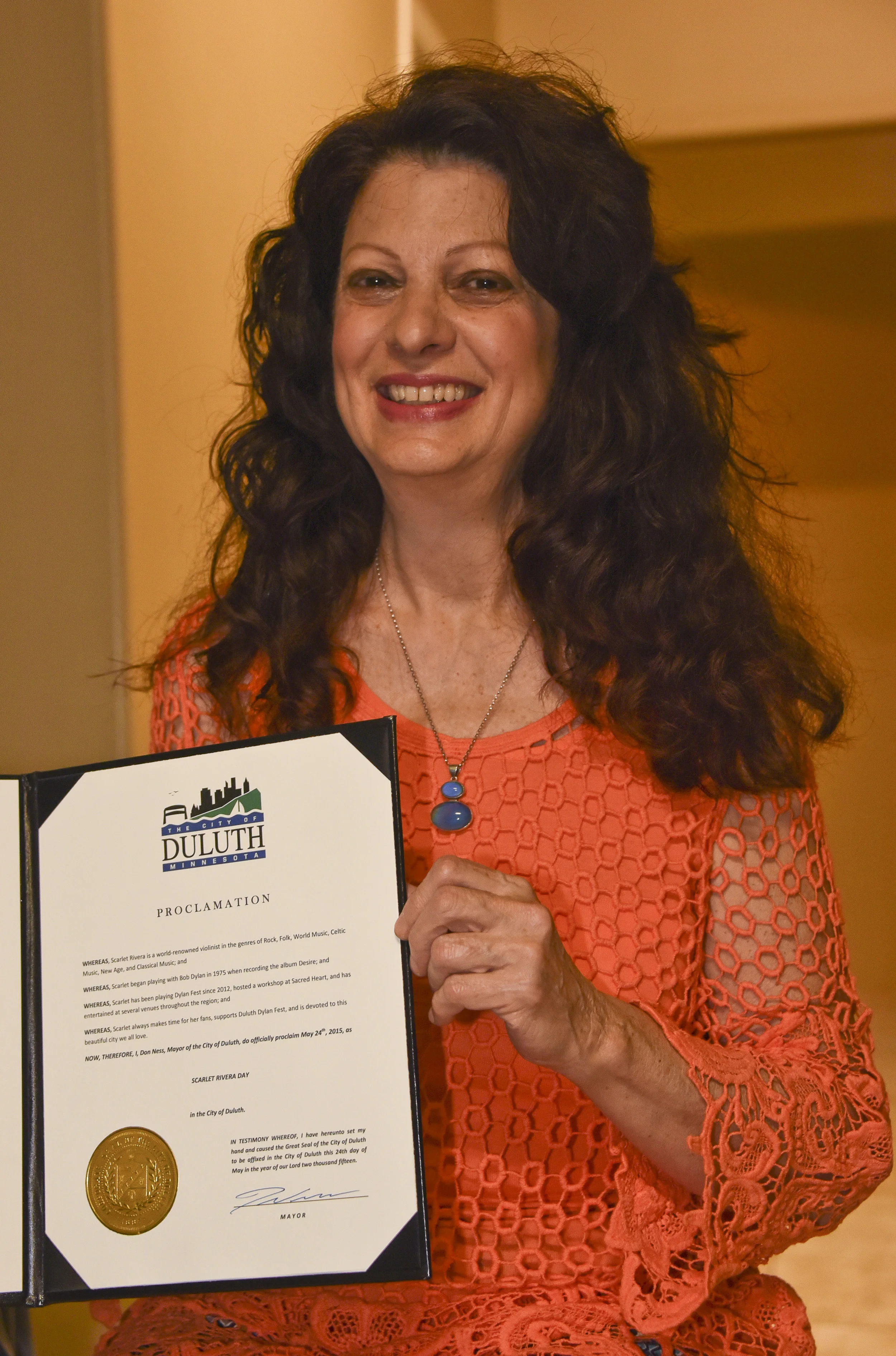 Scarlet Rivera holding the Proclamation for her day / Sacred Heart Music Center / Duluth, Minnesota / May 23rd, 2015 / Photo by Michael K. Anderson