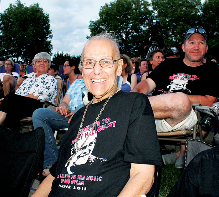  Billy Hallquist, longtime organizer of the “Salute to the Music of Bob Dylan,” enjoys the show Aug. 1. Hallquist is battling concert, but the grinning musician was undeterred from making it on to a full stage to sing along in a closing number. Parti