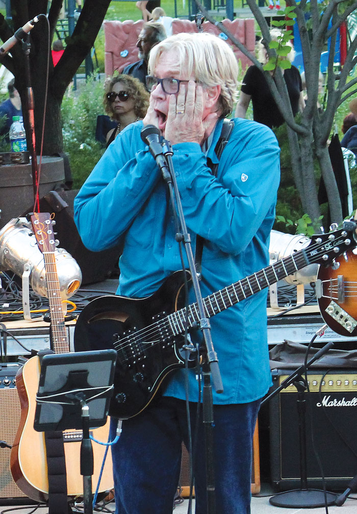  Kevin Odegard pretends to be shocked during a concert featuring the music of Bob Dylan. (Sun Sailor staff photo by Seth Rowe) 