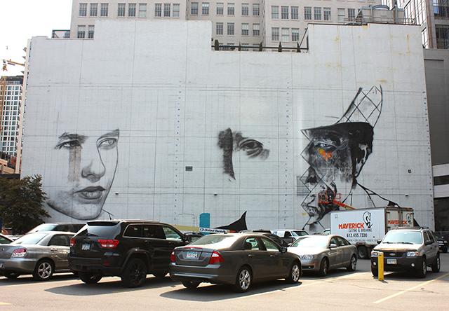 The formerly blank white wall is becoming a triptych of Dylan through the years. (Photo by Bailey Cahlander)