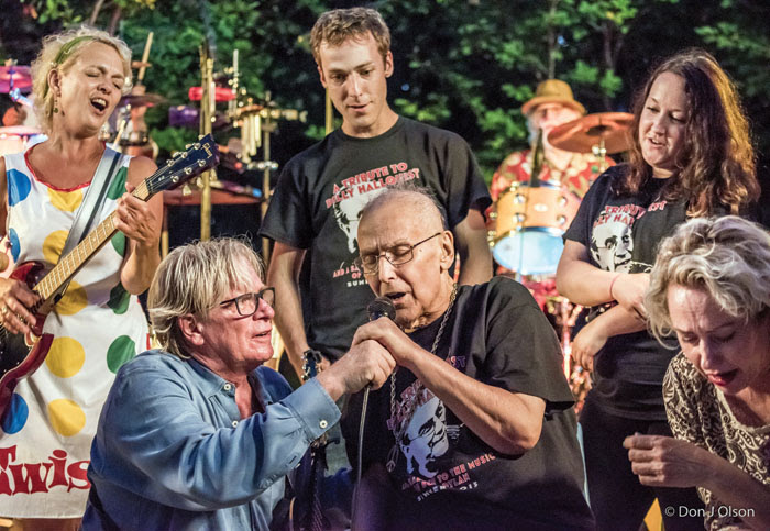  Billy Hallquist, at the microphone, sings as Kevin Odegard assists him at the 2015 Salute to the Music of Bob Dylan in St. Louis Park. (Submitted photo courtesy of Don J. Olson) 