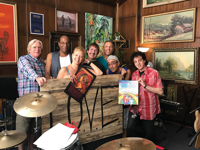  Summer of Love Concert participants rehearse in Levi Stugelmeyer’s studio in anticipation of the July 29 event. From left to right are Kevin Odegard, Stan Kipper, Barbara Meyer, Jim Steinworth, Gary Lopac, Chico Perez and Marc Percansky. (Submitted 