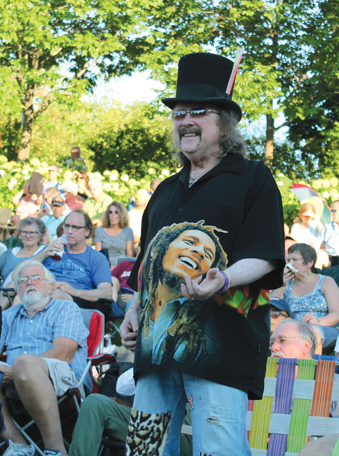  St. Louis Park resident Jim McDonough, Jr., plays the air guitar to the song “Somebody to Love” July 29 in Wolfe Park. (Sun Sailor staff photo by Seth Rowe) 