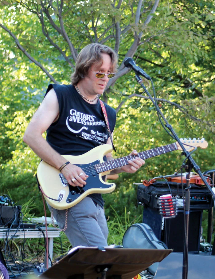 Guitars for Vets founder Patrick Nettesheim performs with the band Kharma Shotgun July 29 at Veterans’ Memorial Amphitheater. (Sun Sailor staff photo by Seth Rowe)