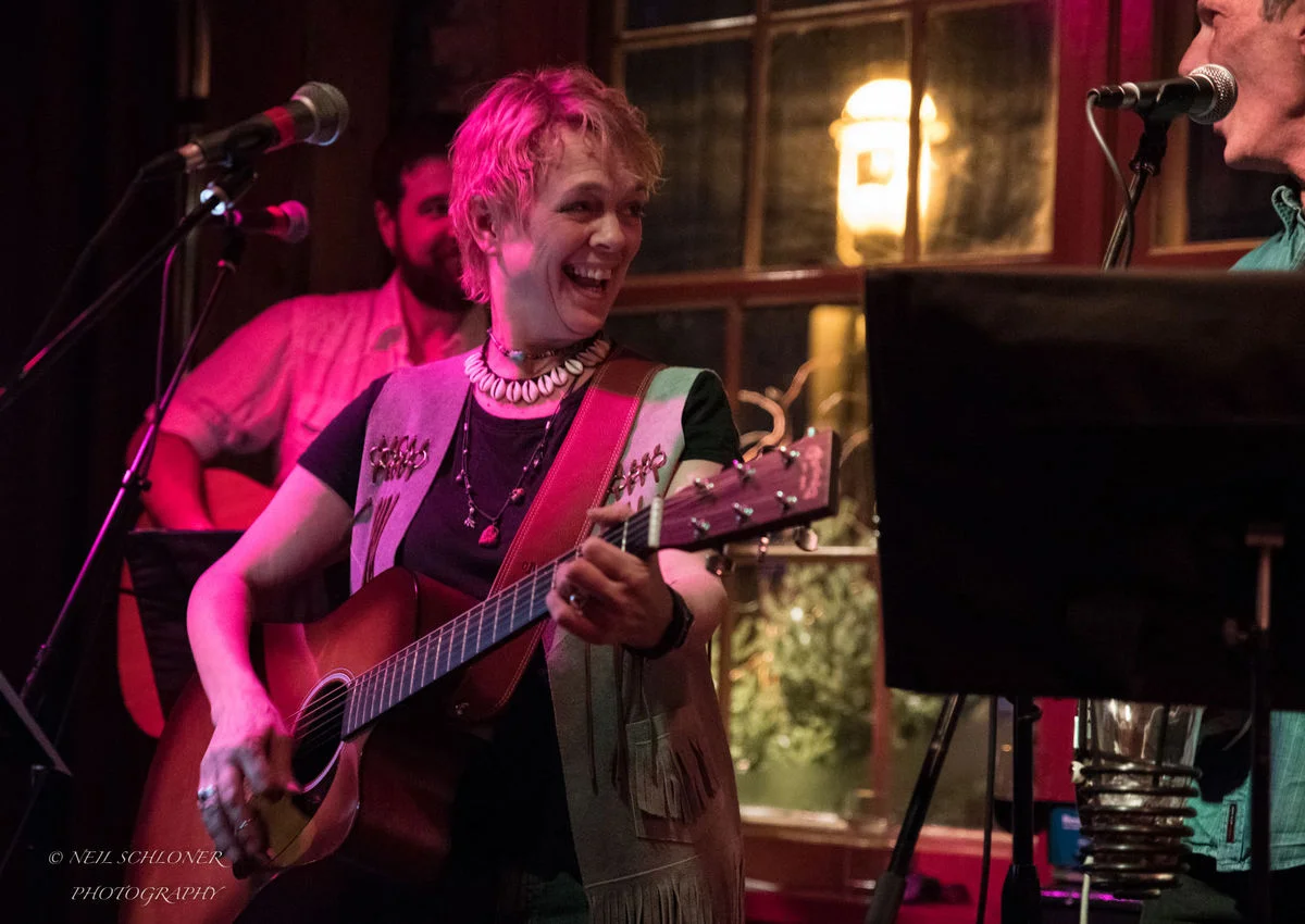 Barbara Meyer plays the guitar at Kevin Odegard's "Better Angels" album release show Dec. 5 at the Aster Cafe in Minneapolis. (Submitted photo courtesy of Neil Schloner)