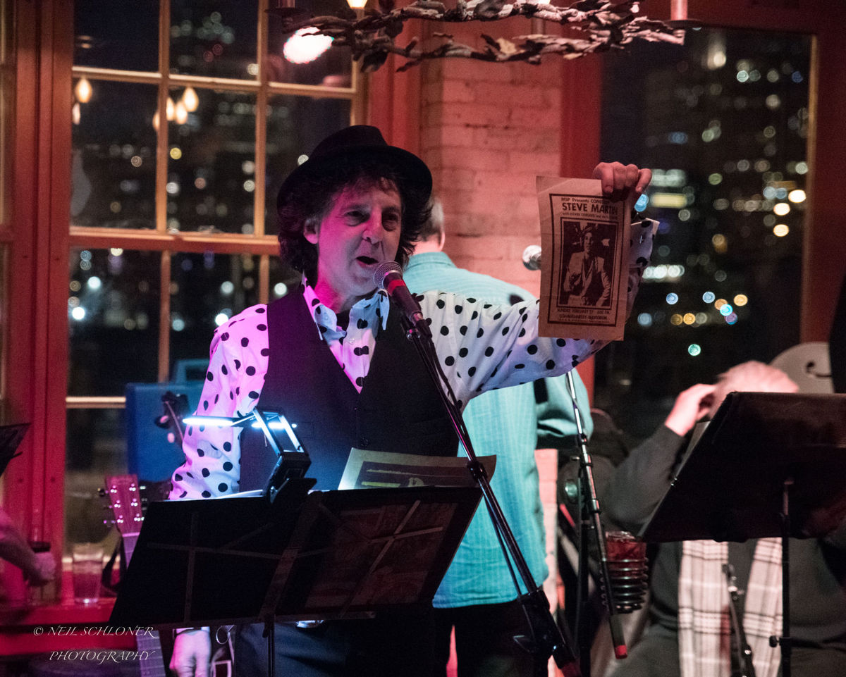 St. Louis Park resident Marc Percansky shares a story about comedian Steve Martin during Kevin Odegard's "Better Angels" album release show at the Aster Cafe in Minneapolis. (Submitted photo courtesy of Neil Schloner)
