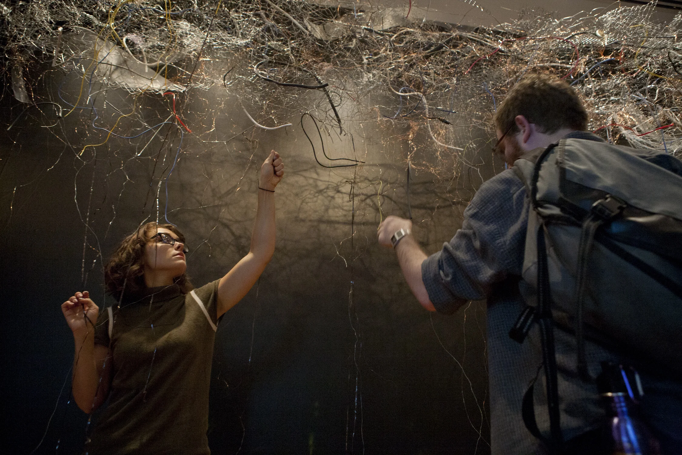 touching the metal wires and nets changes the static played by the radios