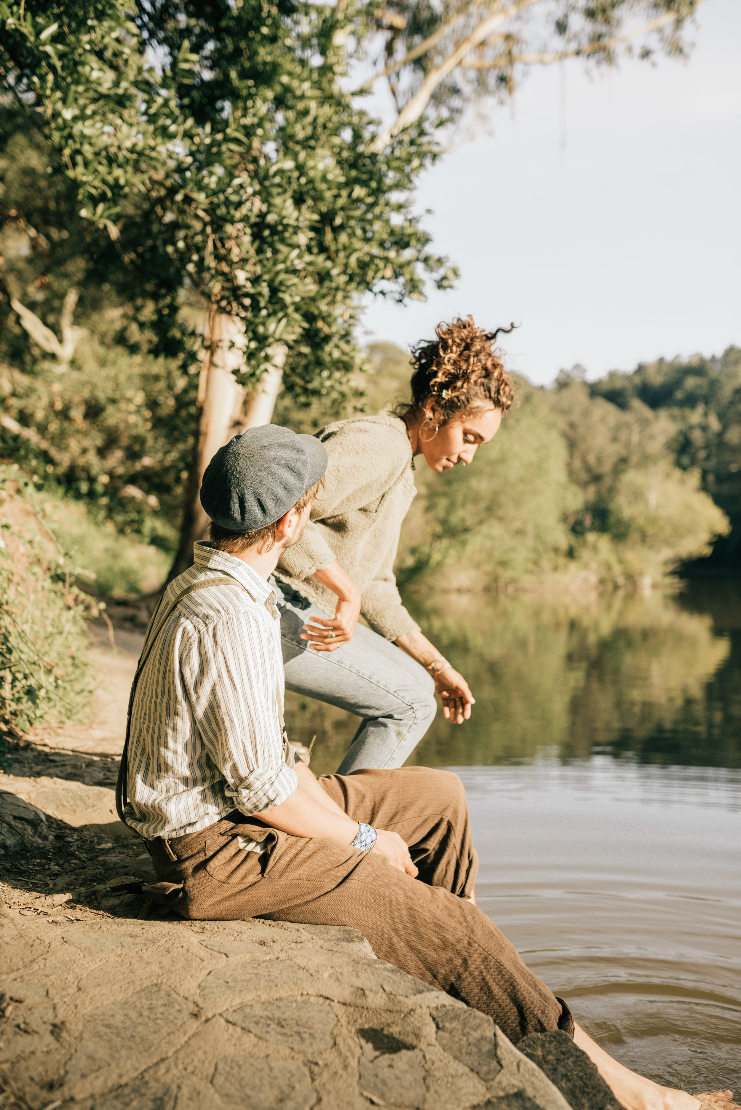 couple sitting next to lake anza. photo by oakland wedding photographer