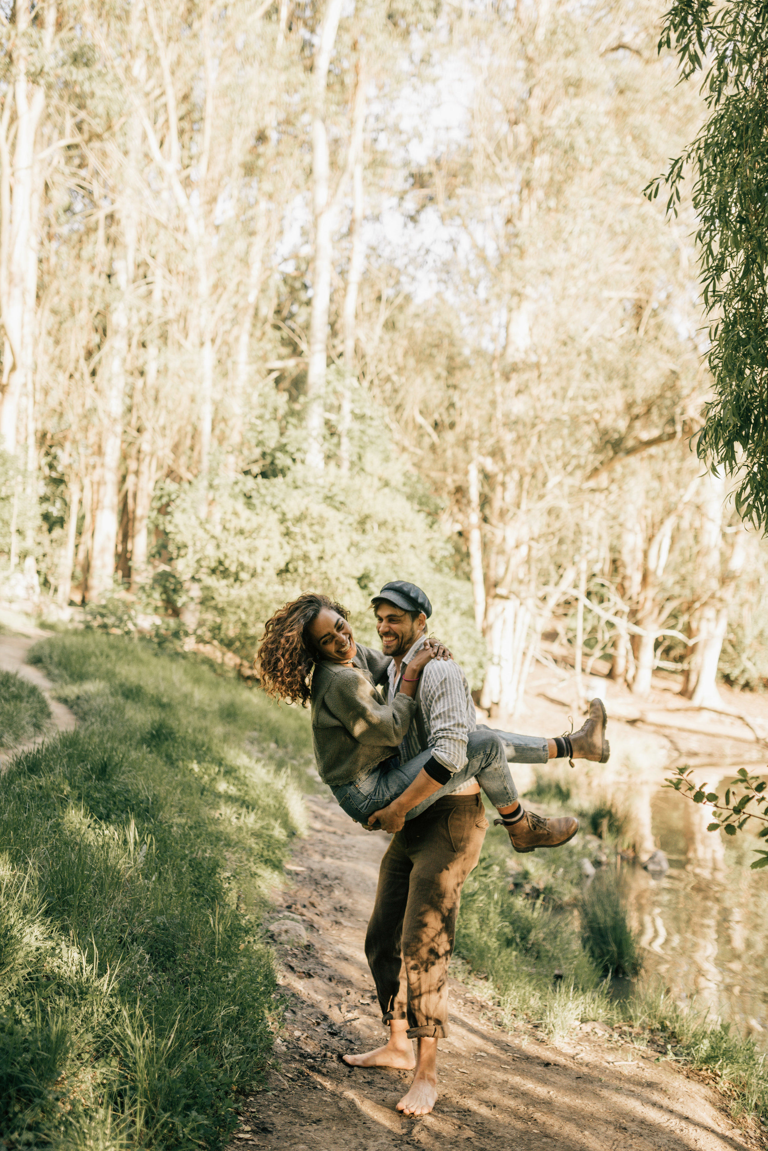 couple laughing on a path in tilden park