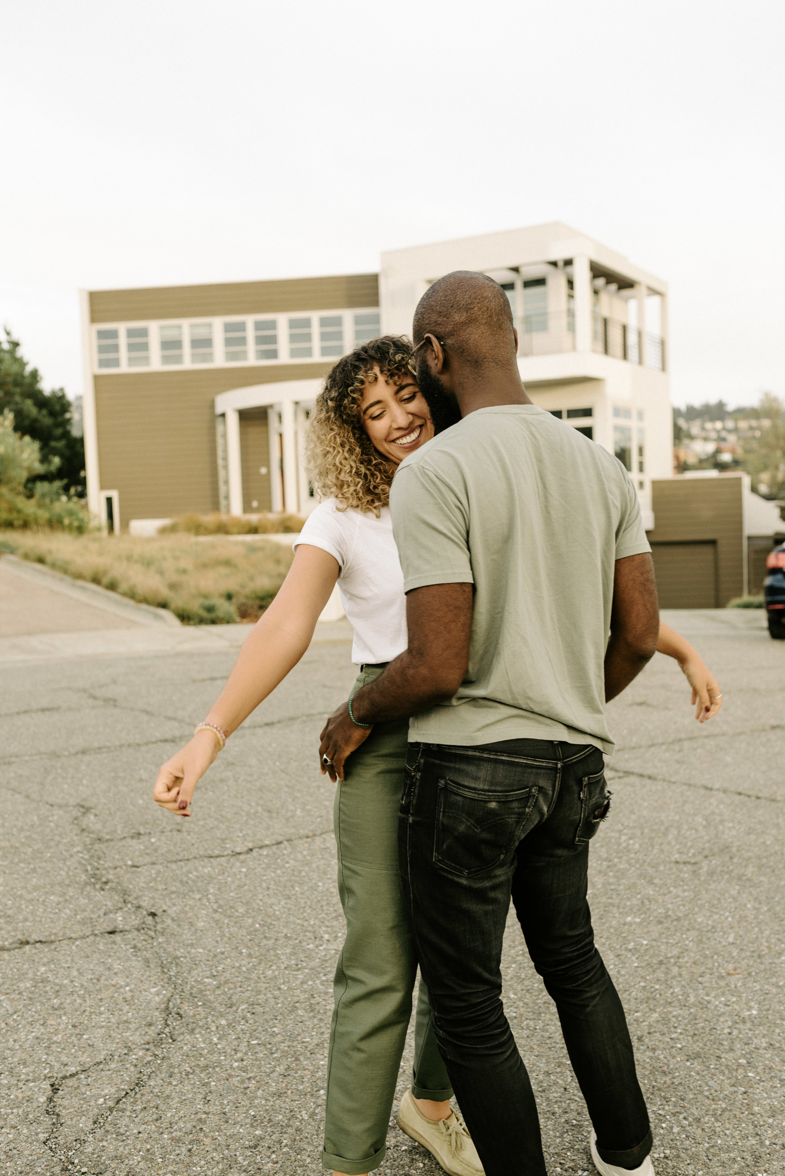 couple on the cul-de-sac in front of a house