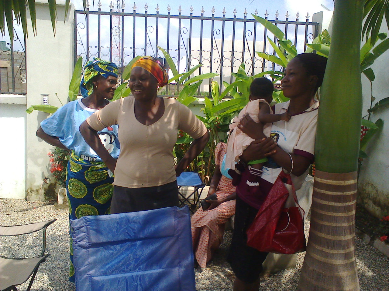 Borrowing Group Members waiting to receive their loans. Borrowing groups support each other in their business endeavors and in their monthly loan repayments.