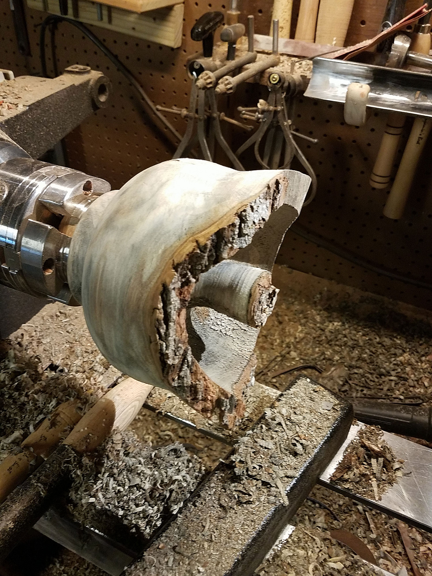 Turning on the wood lathe requires sharp tools to remove excess material from the wood. It's important to carefully plan the final shape for the vessel.