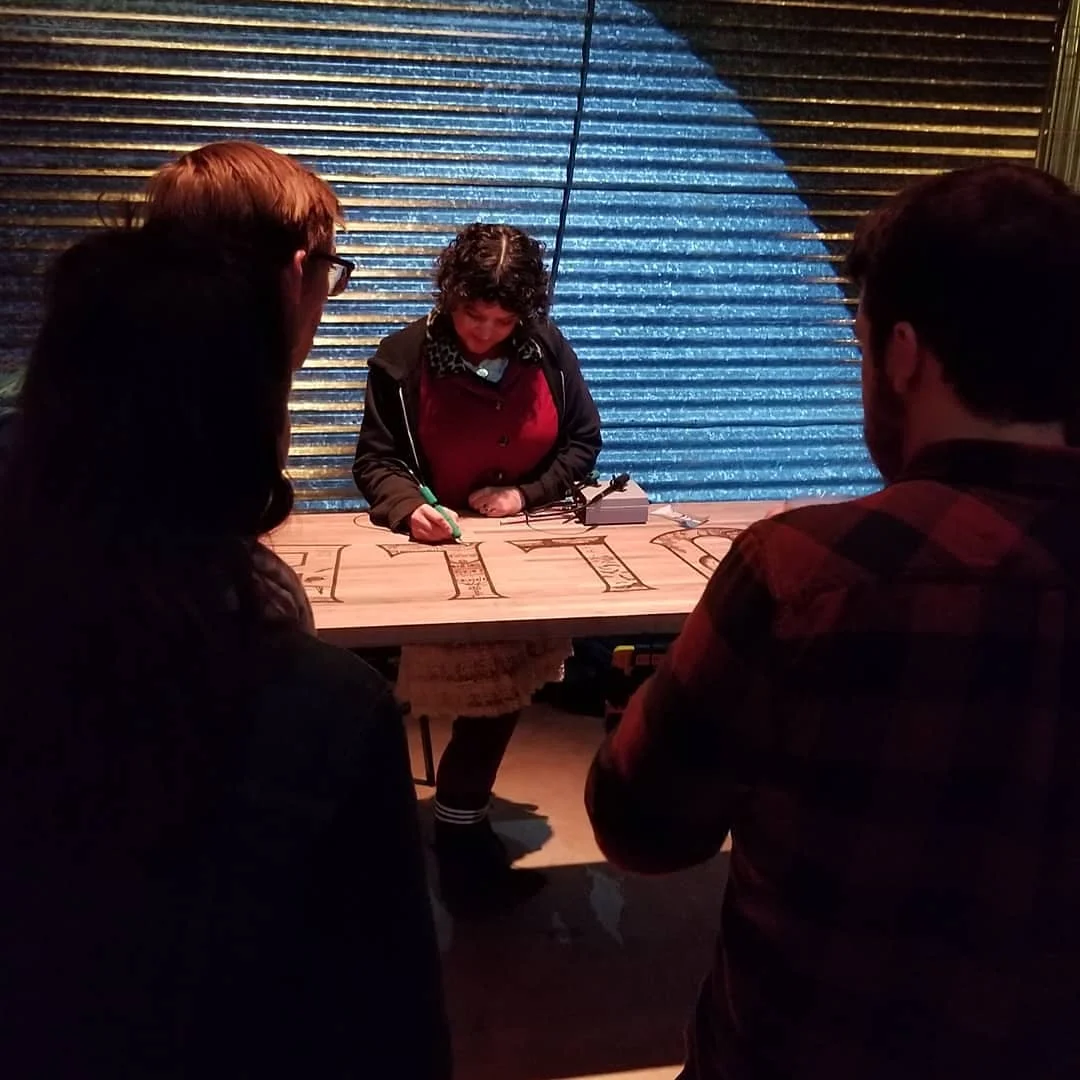 Sarah wood burning live during event.