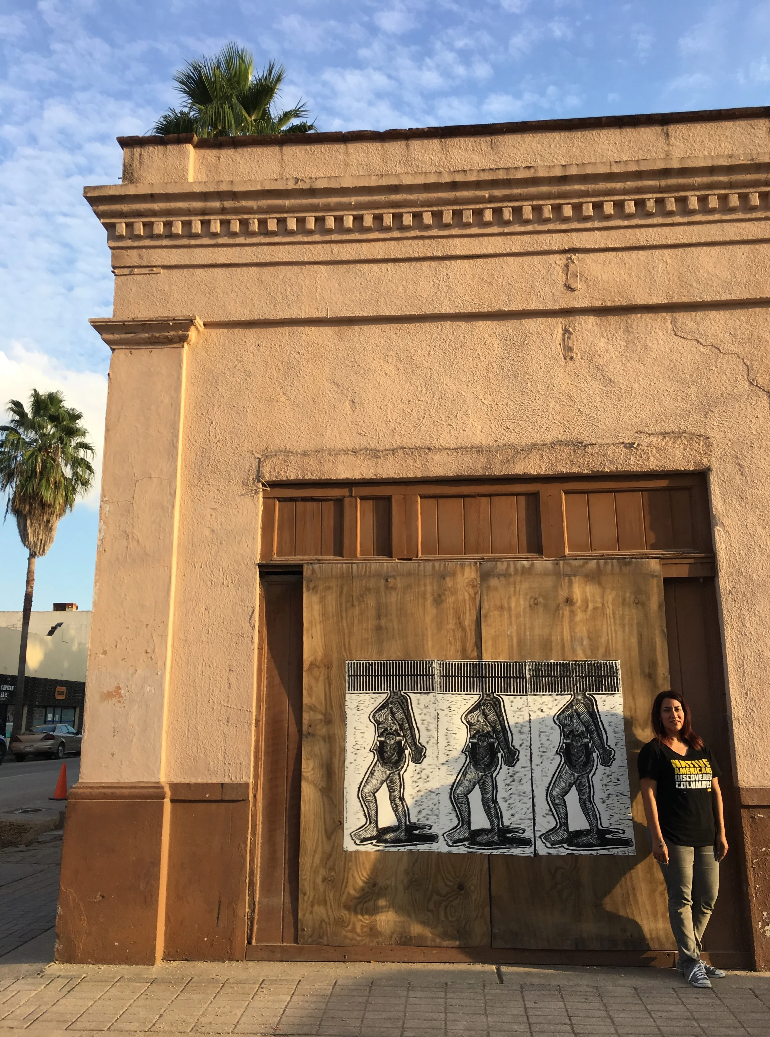 Woman Fence Wheatpaste Installed on San Fernando Building installed in Downtown Brownsville.