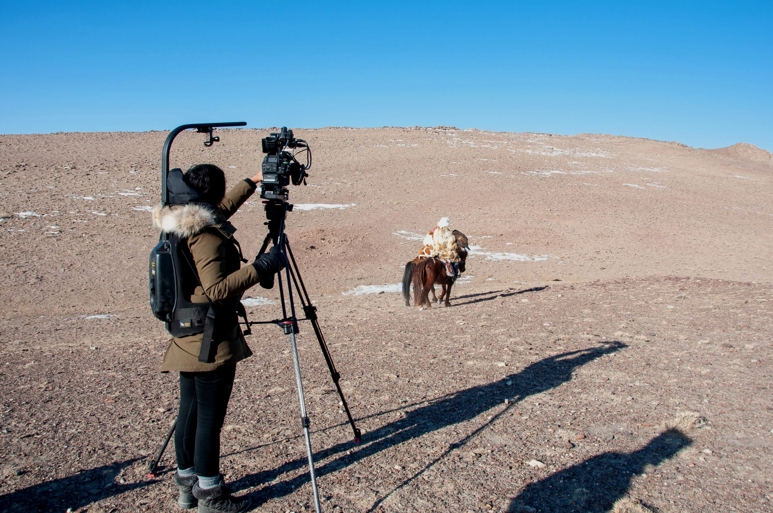 Filming with 13 year-old Akelik, an eagle huntress, in Western Mongolia. Photo: Zac Murray