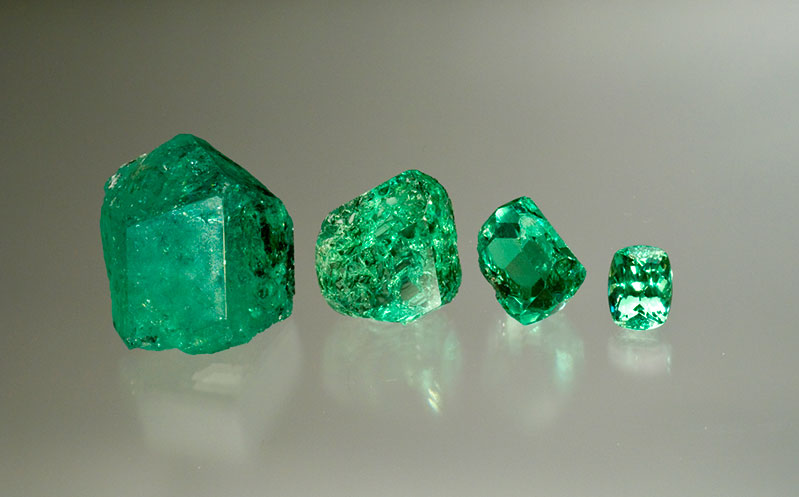  Fine group of mint-green grossular rough.&nbsp;Merelani, Tanzania, with a cut gem of 7+ carats. 