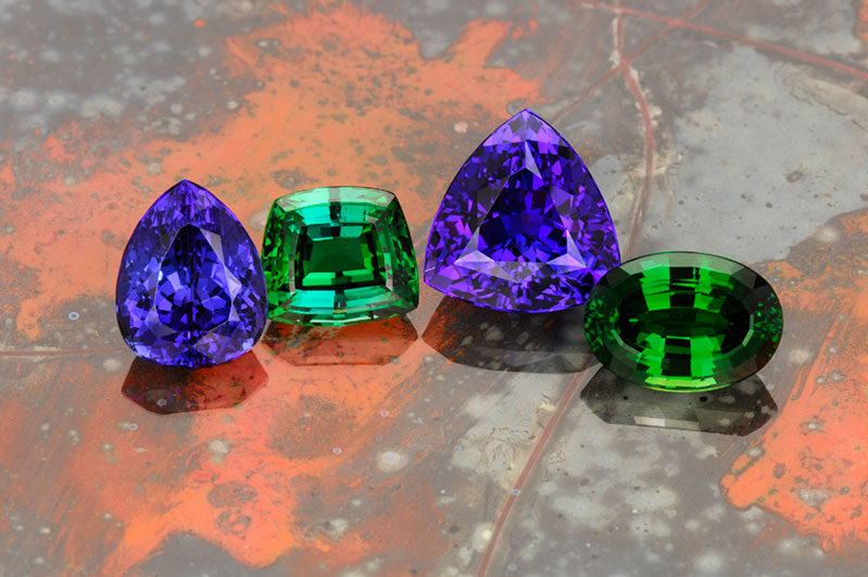  Pala International's gems from Tanzania: (from left to right) tanzanite, tsavorite, tanzanite, and chrome tourmaline. 