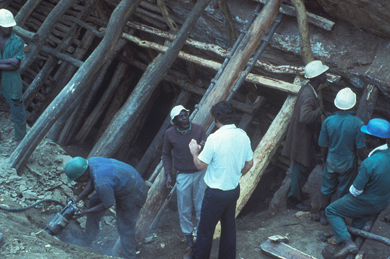  David Howorth speaks with workers&nbsp;at the Lualenyi Mine in Kenya's Taita Taveta District, late 1970s. 