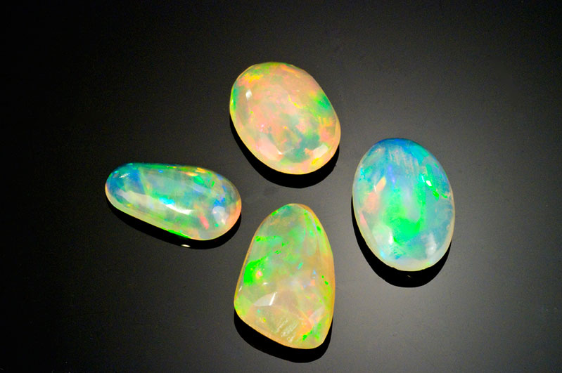  Pala International's Wello opals from Ethiopia show a bounty of colors: clockwise from top, 2.75 ct, 3.38 ct, 3.4 ct, 1.86 ct. 