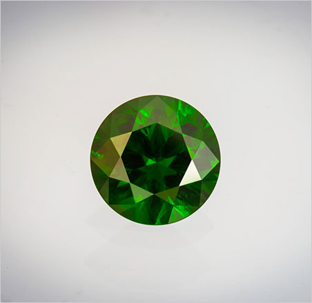 Fir sure , this is a very important gem : evergreen-hued demantoid, 9.61-carat round, 13.02 x 8.2 mm. Click to enlarge. (Photo: Mia Dixon)