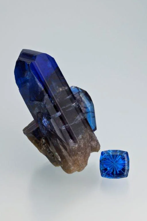 Tanzanite crystal specimen courtesy of Evan Caplan, and the faceted tanzanite, 10.22 carats is courtesy of John Dyer & Co. (Photo: Robert Weldon, © GIA 2012)