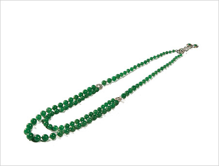 Not only are the jadeite beads beautiful, the necklace's clasp features two diamond and jadeite drops. (Photo: Grogan & Company news release via ArtfixDaily)