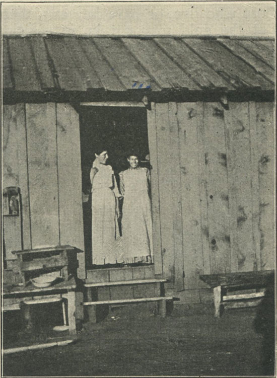 Mountain girls at cabin door