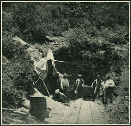 At the entrance to a tunnel of a San Diego tourmaline mine.