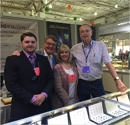 3 + 1. Pala International's Carl, Bill and Jeanne Larson at the AGTA GemFair with Julius Petsch, a famous dealer from Idar-Oberstein, Germany.