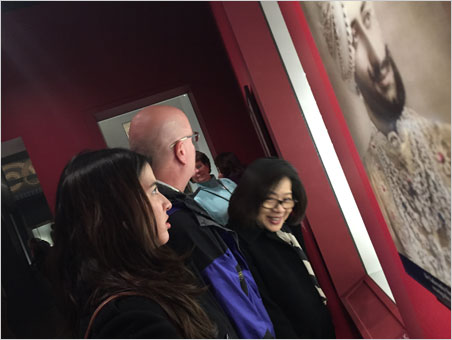 Catching everyone's best side. A candid moment at "Brilliant: Cartier in the 20th Century." From left, Billie Hughes frowns at the excesses of a maharajah (Bhupinder Singh), Richard Hughes shakes his head at the display case (many of the maharajah's jewels, below, having been replaced by replicas), and Wimon Manorotkul winks at the camera. (Photos: David Hughes)