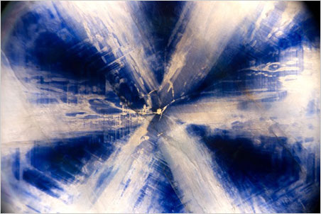 Trapiche sapphire. Specimen courtesy of Jeffery Bergman. This photo was awarded an honorable mention in the Gem-A's 2014 photo competition. (Photomicrograph: Richard W. Hughes, Lotus Gemology)