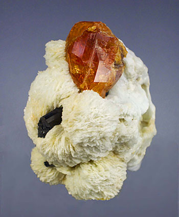 Spessartite with schorl tourmaline and clevelandite from the Little Three mine at Ramona, San Diego County, California. (Photo: Wimon Manorotkul)